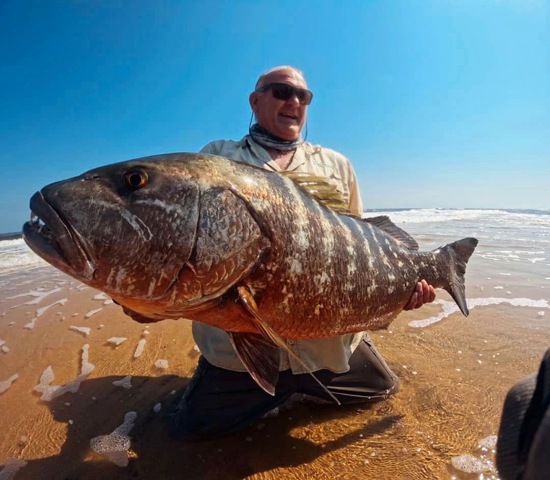 Angler holding a large mottled fish