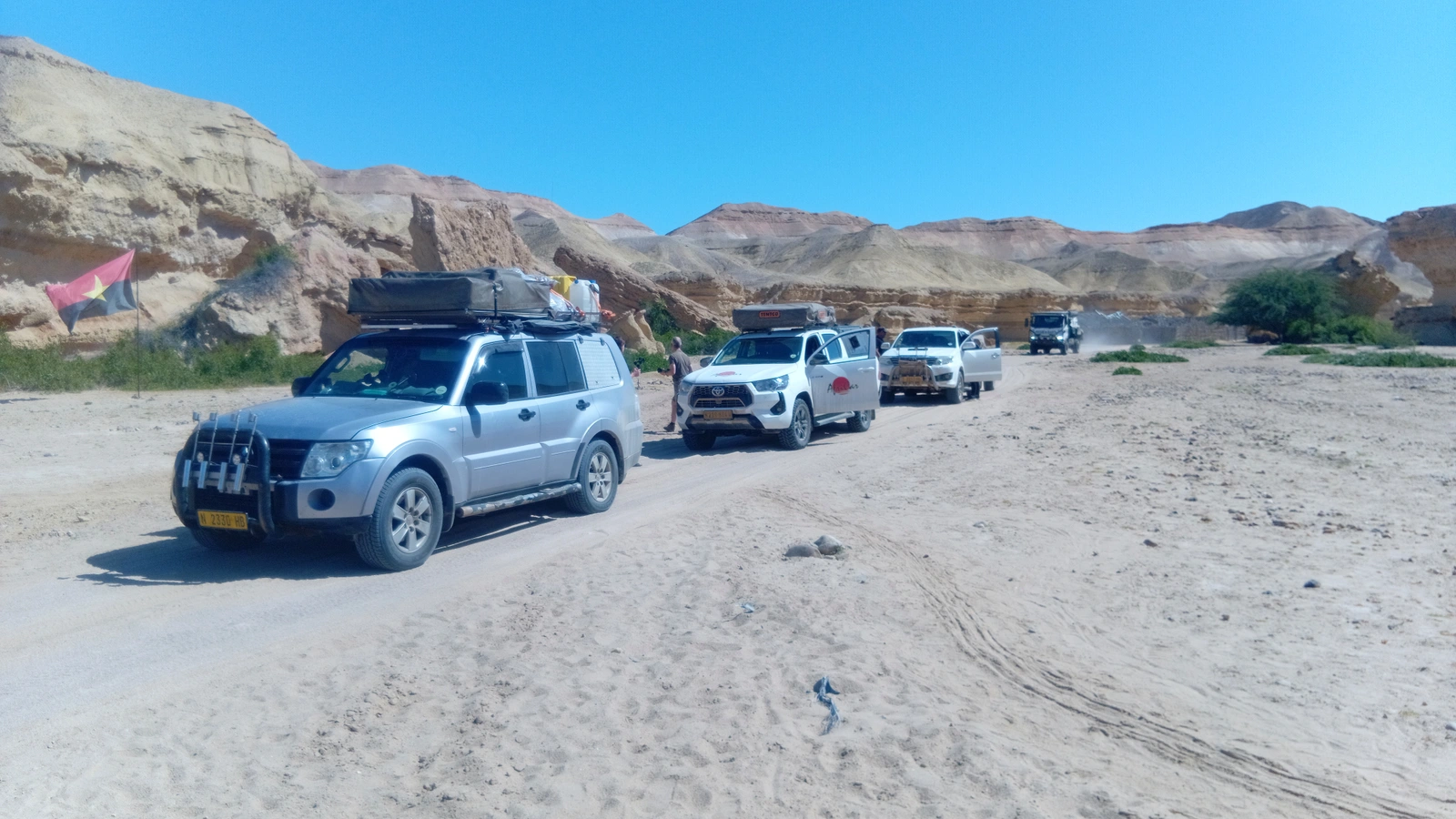 A convoy travelling through a rocky landscape