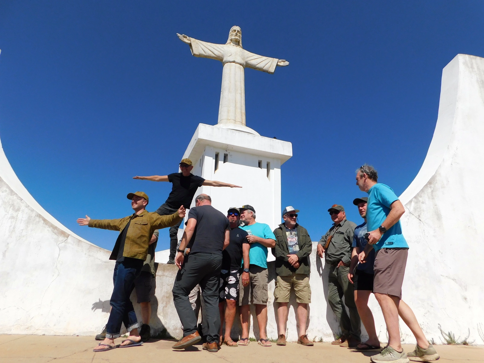 Travellers in front of a white monument