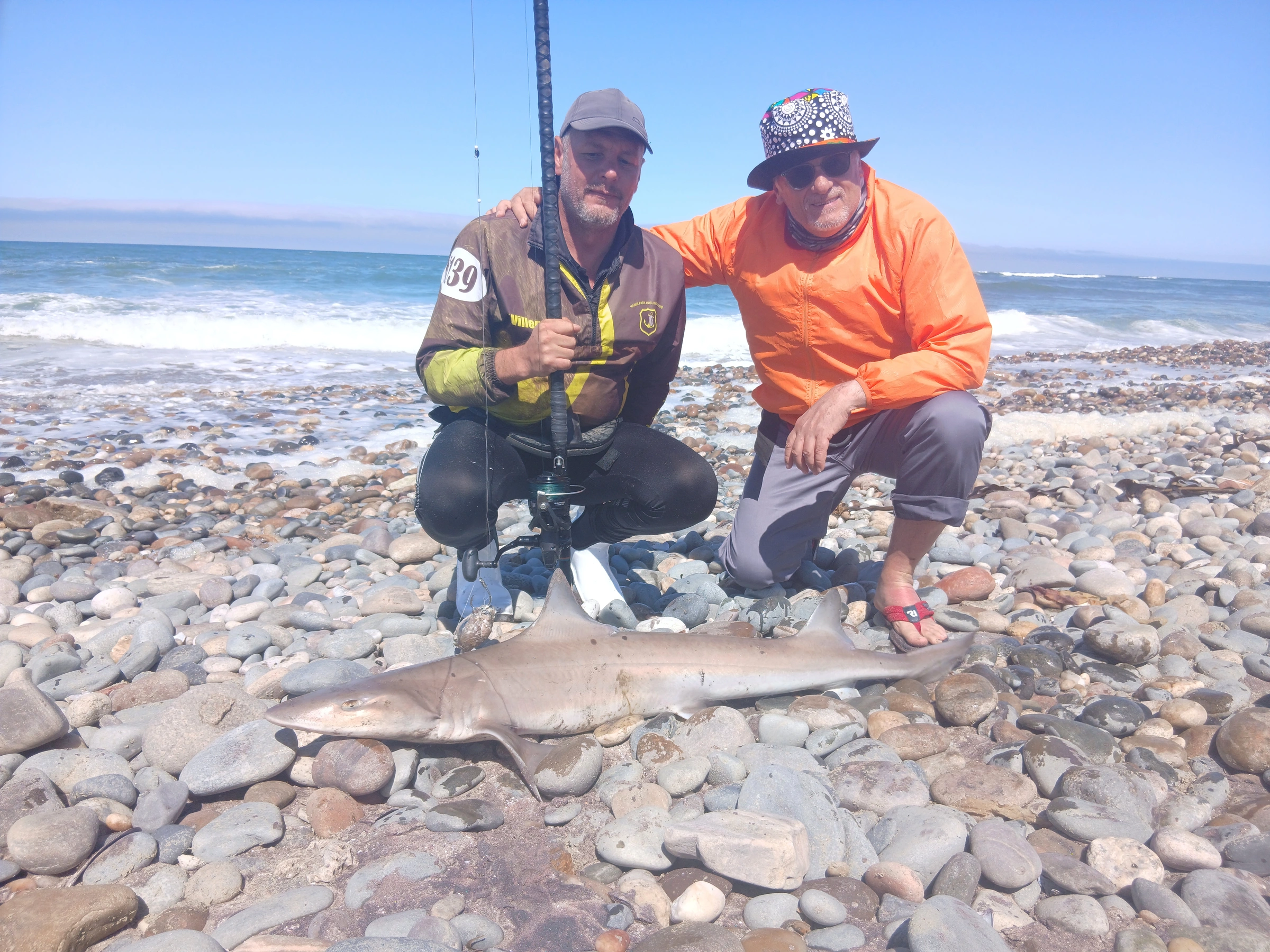 Client holding a fish during a guided Henties Bay shore fishing trip