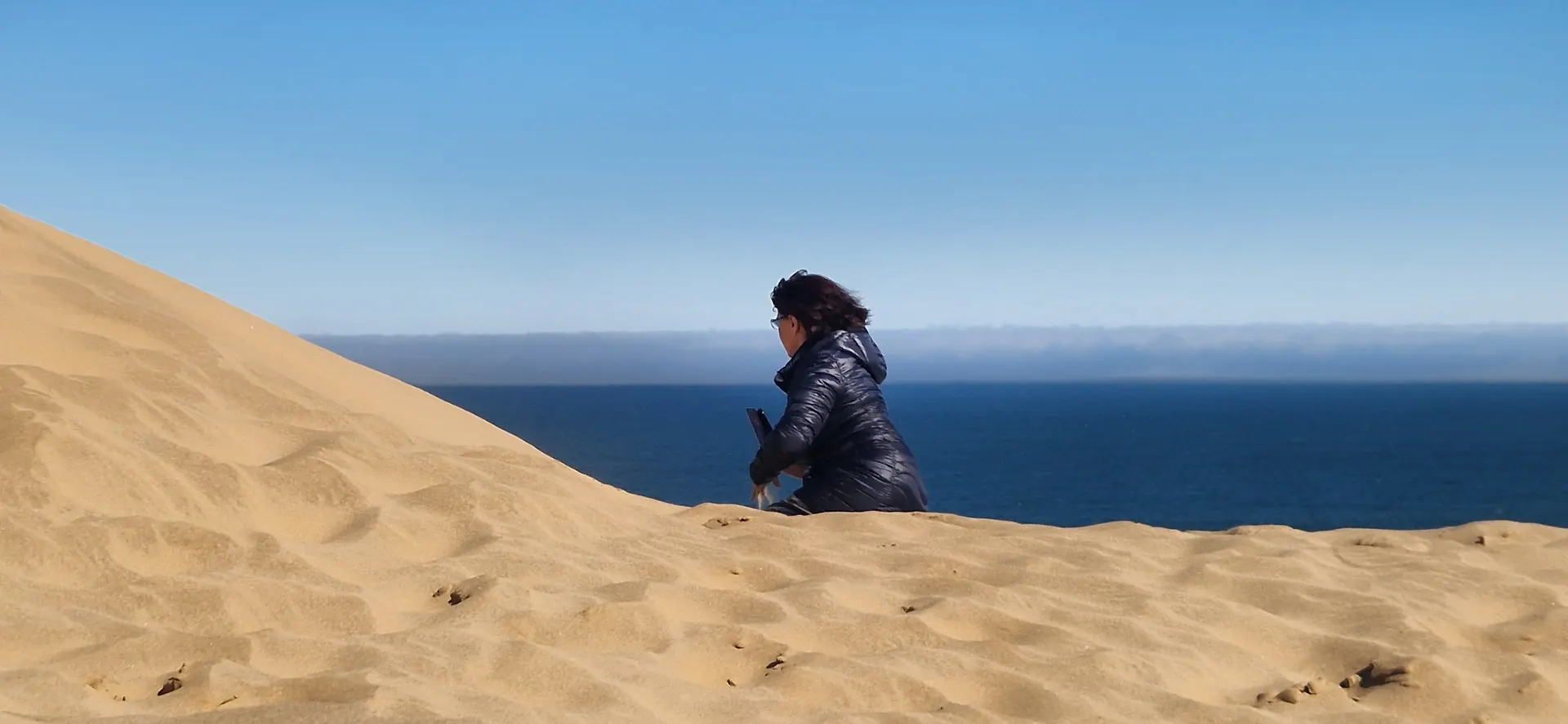 Sandwich Harbour dunes meeting the Atlantic coast in Namibia
